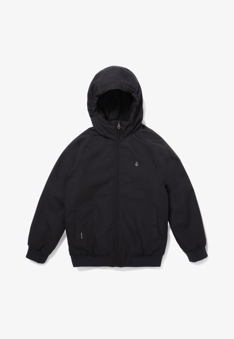 Veste noire à capuche avec fermeture éclair à l'avant, deux poches latérales, poignets élastiques et petit logo sur la partie gauche de la poitrine, présentée sur fond blanc.