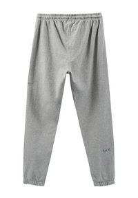 Helle graue Jogginghose aus Baumwollmischung, mit einem elastischen Bund, schmal zulaufenden Beinen und kleinem 'F.U.T.'-Druck am unteren linken Bein.