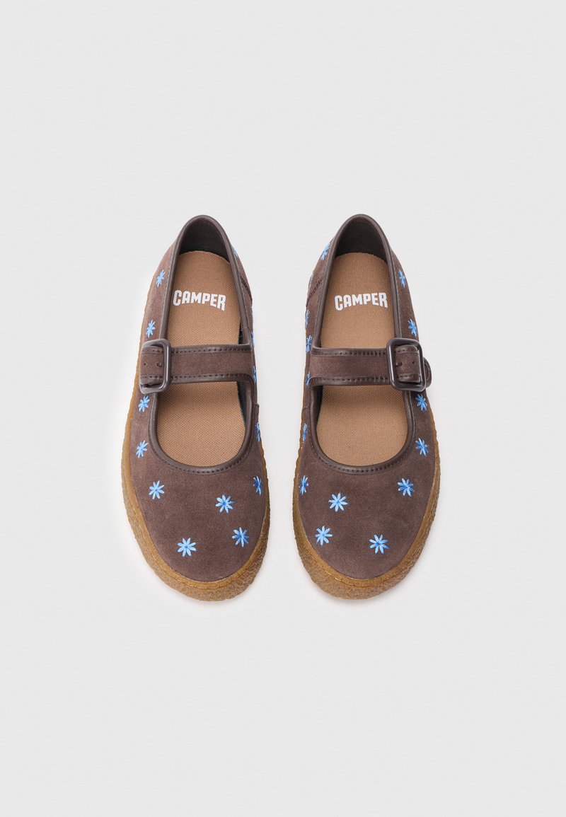 Brown suede Mary Jane shoes with a round toe, blue floral embroidery, and a buckle strap. Textured brown sole for traction.