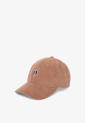 Casquette de baseball en velours côtelé marron avec une visière courbée et un petit logo circulaire noir et blanc sur le panneau avant.