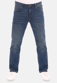 Jeans in denim di colore blu scuro con effetto sbiadito. Design classico a cinque tasche con dettagli di cucitura. Completati con un bottone e una zip.