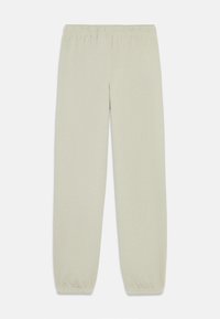 Helle graue, elastische Sweatpants mit tapered Beinen und elastischen Bündchen. Weicher, strukturierter Stoff ohne sichtbare Muster oder Hardware.