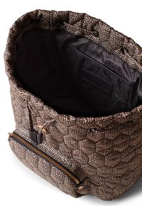 Textured, patterned bag in brown and beige with a drawstring closure and a zippered front pocket. Interior features a smooth black lining.