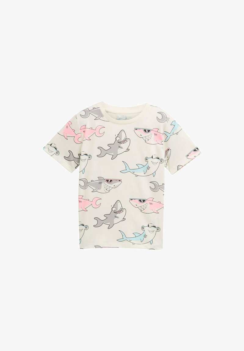 Kurzarm-T-Shirt mit einem cremfarbenen Hintergrund und verspielten Hai-Illustrationen in Grau, Pink und Blau. Hergestellt aus weichem Baumwollstoff.