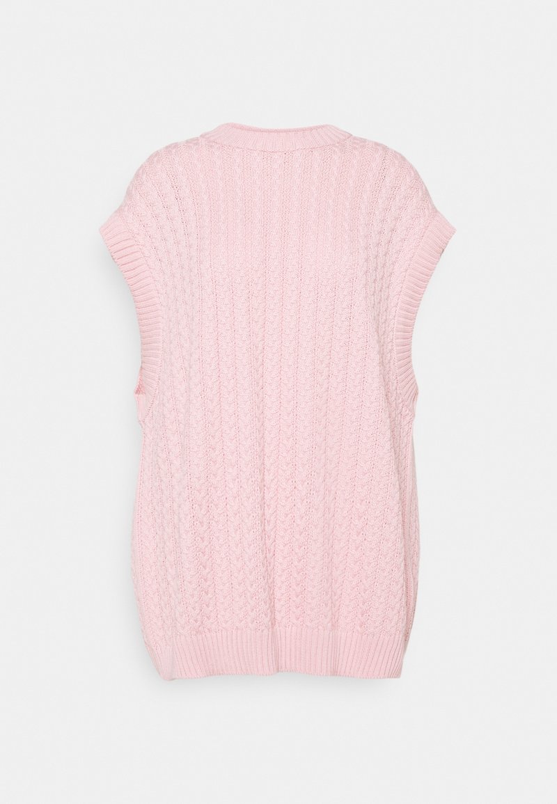 Růžový pletený bezrukávový svetr s ribhovanou texturou a širokým výstřihem. Disponuje složitými kabelovými vzory a volným střihem.