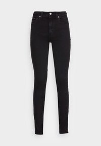Jeans ajustados de tiro alto en negro, fabricados en denim, con un corte ceñido, bolsillos frontales y un logo acentuado a lo largo de las costuras laterales.