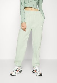 Nike Sportswear W NSW ESSNTL PANT FLC TREND - Calças de fato de treino - seafoam/black