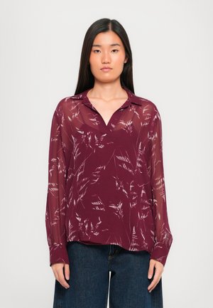 Bordeaux blouse met lange mouwen, bloemenprint en een v-halslijn. Gemaakt van sheer stof, met een relaxte pasvorm.