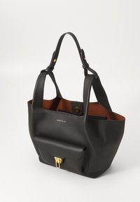 Black leather tote bag with textured finish, brown interior, gold hardware accents, and a front pocket with a clasp closure.