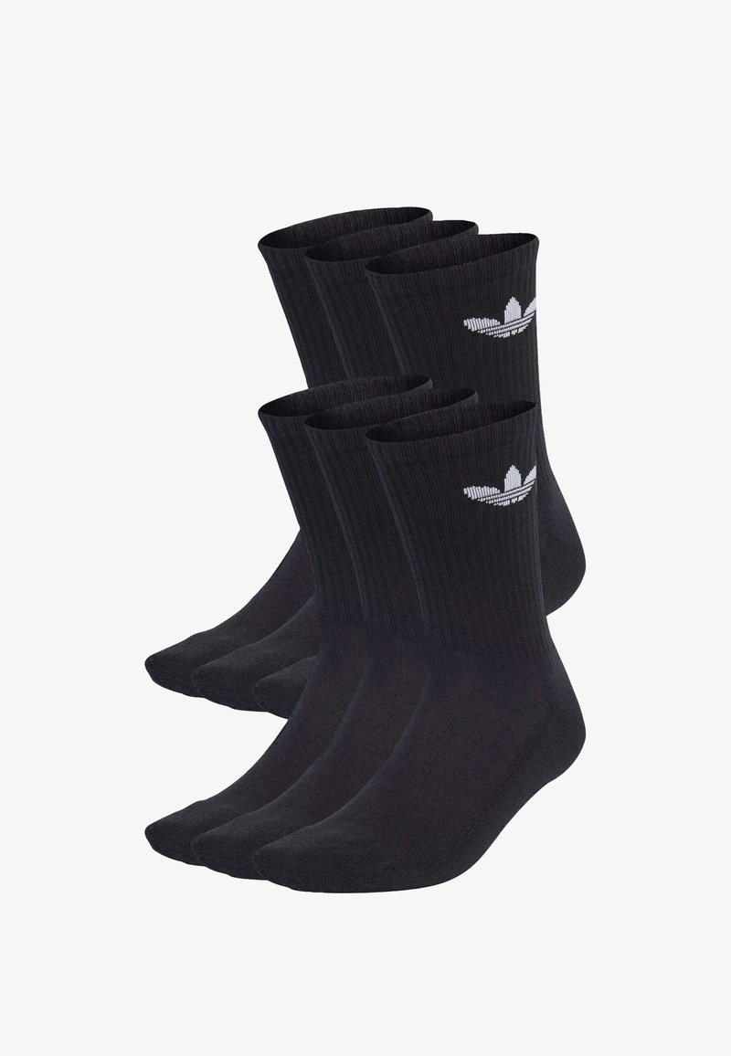 Čierne bavlnené ponožky po členky s rebrovanou textúrou, so bielym logom Adidas na boku. Balíček štyroch párov.