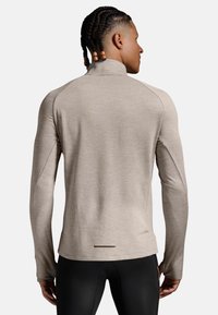 2XU IGNITION 1/4 - Stickad tröja - carbon black reflective