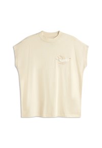 Crème-kleurig oversized t-shirt met korte mouwen, voorzien van een geborduurd vogelontwerp op de linkerborst in neutrale tinten.