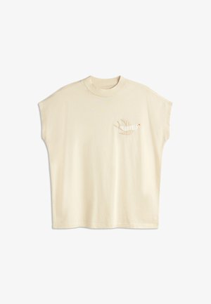 Cream-colored oversized t-shirt with short sleeves, featuring an embroidered bird design on the left chest in neutral tones.
