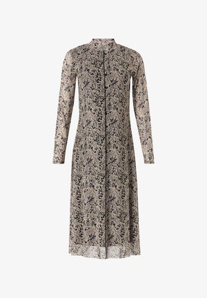 Sukienka z długim rękawem, wykonana z lekkiego materiału, w beżowej bazie z czarnym abstrakcyjnym wzorem oraz prostym kroju.