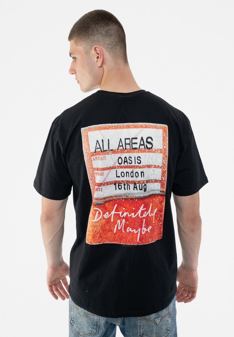 Black t-shirt featuring a colorful graphic on the back with the text "ALL AREAS," "OASIS," and "London 16th Aug," and a red-orange design.