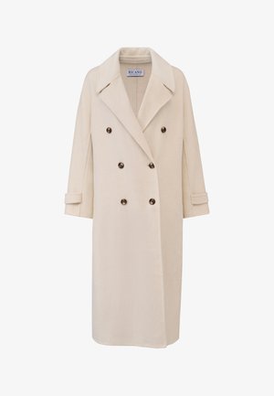 Beige dobbeltradet frakke lavet af blødt stof, med et notched krave, store brune knapper og opkrogede ærmer, der giver en afslappet pasform.