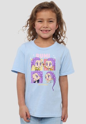 Light blue cotton T-shirt featuring a graphic of four cartoon character illustrations with purple hair and bright accents.