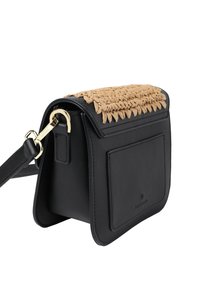 Black leather handbag with a woven natural fiber flap, rectangular shape, gold hardware, and a front pocket detail. Adjustable strap included.