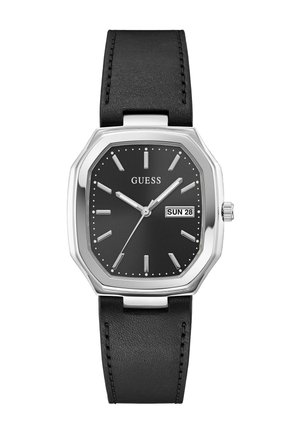 Černé hodinky Guess se stříbrným osmihranným pouzdrem, černým koženým páskem, stříbrnými hodinovými indexy, ručičkami a zobrazením data ukazující neděli 28.