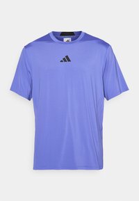 Purple athletic t-shirt made of lightweight fabric with short sleeves. Features a black Adidas logo on the chest and a round neckline.