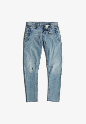 Hellblaue Jeans aus Denim mit taillierter Passform, fünf Taschen und dezenter Ausbleichung. Sie verfügen über eine glatte Textur und kontrastierende Nähte.