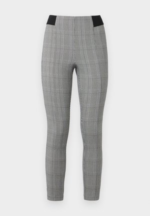 Pelēku raižotu legingu ar pieguļošu dizainu, kas aprīkoti ar melnu elastīgu jostu un sānu kabatām. Teksturēta auduma ar pārbaudes rakstu.