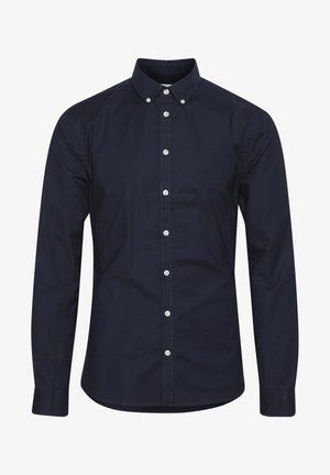 Granatowa koszula z długim rękawem zapinana na guziki, wykonana z bawełny, z kołnierzykiem zapinanym na guziki, białymi guzikami i subtelnym logo na piersi.