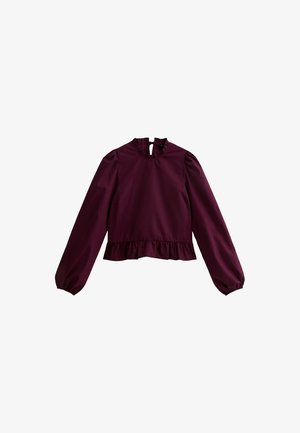 Blouse à manches longues de couleur violet foncé avec un col et un ourlet à volants, dotée d'une fermeture à bouton en forme de clé au niveau de l'encolure arrière.