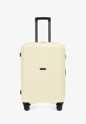 Valise rigide de couleur crème avec quatre roues noires et une poignée rétractable noire, étiquetée "Epic" au centre.