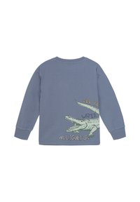 Langærmet blå sweatshirt med et grafisk motiv af en grøn alligator og teksten "Vi ses senere, alligator" i legende skrifttyper. Blødt bomuldsstof.