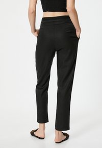 Koton Pantaloni - black