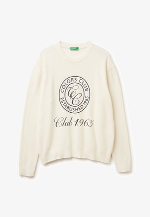 Pull en tricot couleur crème avec un design de logo rond portant les inscriptions "Colors Club Established 1965" et "Club 1965" imprimées en bleu marine.