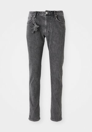 Jean en denim noir avec une coupe slim, dotés d'une fermeture à bouton à l'avant, de cinq poches et d'un petit détail de porte-clés sur la poche gauche.