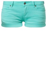 Vihreät farkkuhousut, joissa on käännetty helma, kaksi etutaskua, takatasku ja etunappikiinnitys. Sileä pinta ja vartalonmyötäinen muotoilu.