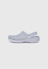 Light purple plastic clog with ventilation holes, a back strap, and a textured sole. Minimalistic design with smooth surface.