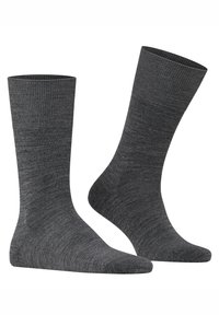 Grå bomuldssokker med ribbet tekstur, midt på læggen længde og forstærket tå. Har en ensfarvet og sømløs design.