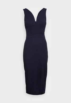 Navy blue fitted dress with a deep V-neckline and sleeveless design, featuring a tapered silhouette and knee-length hem. Smooth fabric texture.