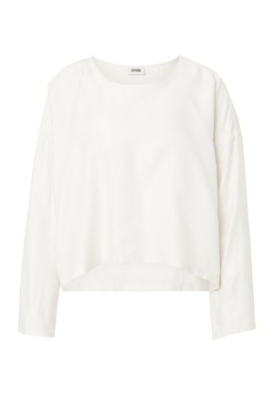 Blusa blanca de manga larga para mujer con escote redondo, dobladillo ligeramente crop, y tela suave, con etiqueta "Drykorn" en el interior del cuello.