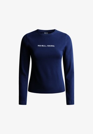 Mørkeblå langærmet skjorte med rund halsudskæring, prydet med "RED BULL RACING" trykt i hvid, lavet af et blødt og glat stof.