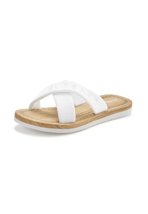 White slide sandal with cross straps, rubber material, textured sole, and wooden effect footbed. Subtle branding on the upper strap.