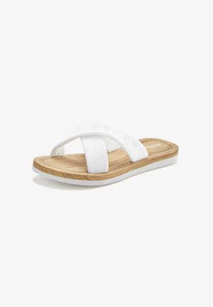 White slide sandal with cross straps, rubber material, textured sole, and wooden effect footbed. Subtle branding on the upper strap.
