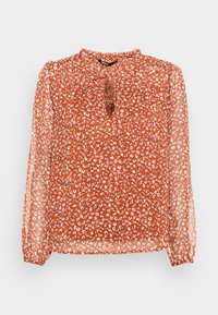 Rote Bluse mit floralem Muster, langen durchsichtigen Ärmeln, gerafftem Ausschnitt und einem Schlitzdetail vorne. Mit kleinen weißen Blumenmustern durchzogen.