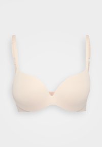 Lys beige polstret BH med glatte, sømløse kopper, justerbare stropper og en U-formet midtdetalj. Laget av mykt, elastisk materiale.