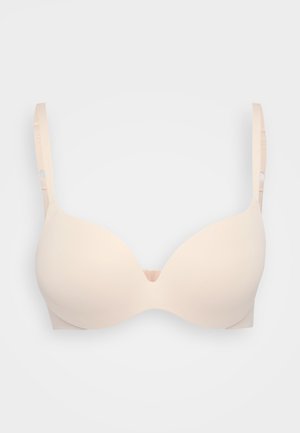 Sostenitore beige chiaro imbottito con coppe lisce e senza cuciture, spalline regolabili e un dettaglio centrale a forma di U. Realizzato in materiale morbido ed elastico.
