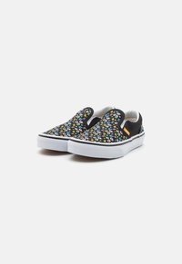 Des chaussures noires à enfiler avec un imprimé floral de différentes couleurs. Semelle en caoutchouc blanche, col rembourré et accents latéraux contrastés.