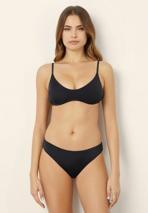 Black bikini set featuring a simple design with thin straps and a scoop neckline, smooth fabric texture, and a low-rise brief.