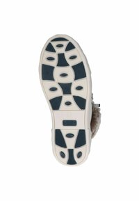 Suela de zapato con base blanca, patrón de agarre negro texturizado, múltiples recortes ovalados y un logotipo circular en el centro.
