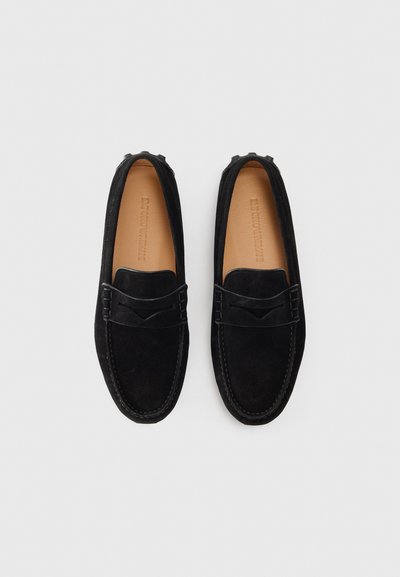 Black suede loafers with a textured band across the front, stitching details, and a smooth leather interior. Flat, flexible design.