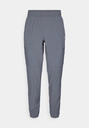 Pantalones de stretch gris claros, ligeros, con una cintura elástica, corte ajustado y bolsillos laterales en ángulo, con sutiles detalles de costura.