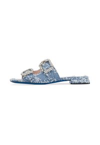 Denim slide sandals with two decorative buckle straps, featuring frayed edges and a flat sole. Color: light blue with white accents.